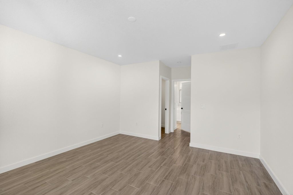 Spacious bedroom with high ceilings in a completed AM Homes build