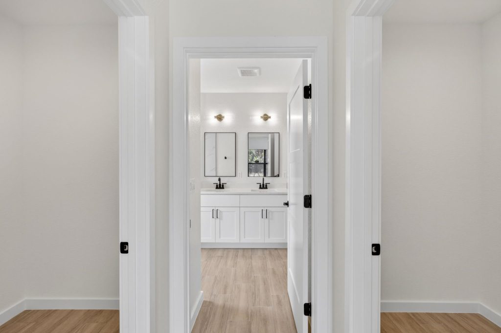 Hallway view into the bathroom of a completed AM Homes build