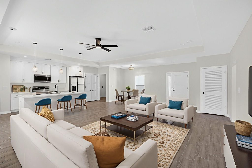 Open-plan living room and kitchen with island seating in an AM Homes build